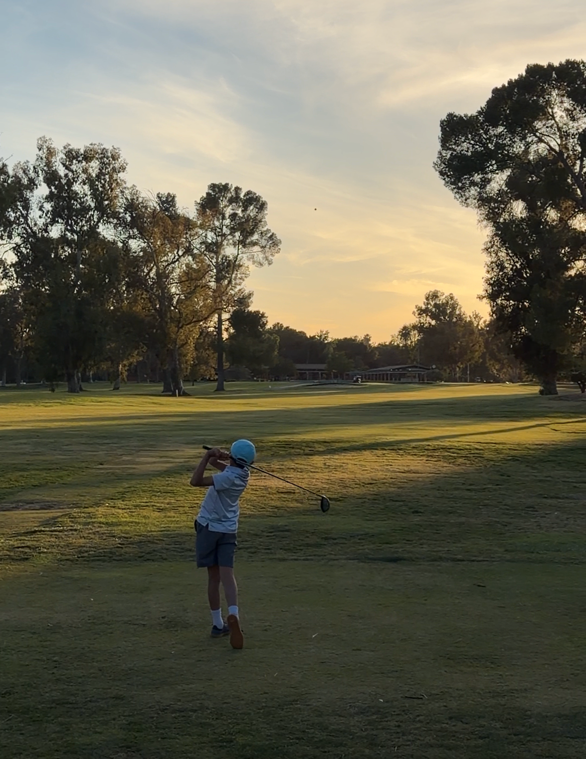 Golf kid playing lesson on course with Coach Nondh